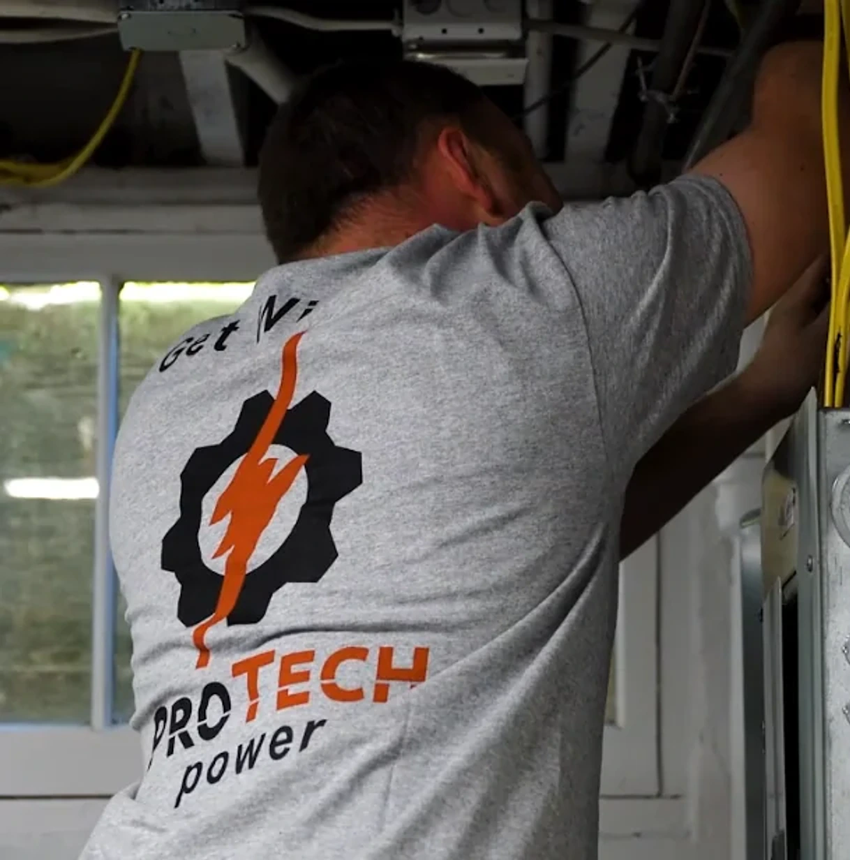 A Pro Tech Power apprentice working on an overhead electrical installation