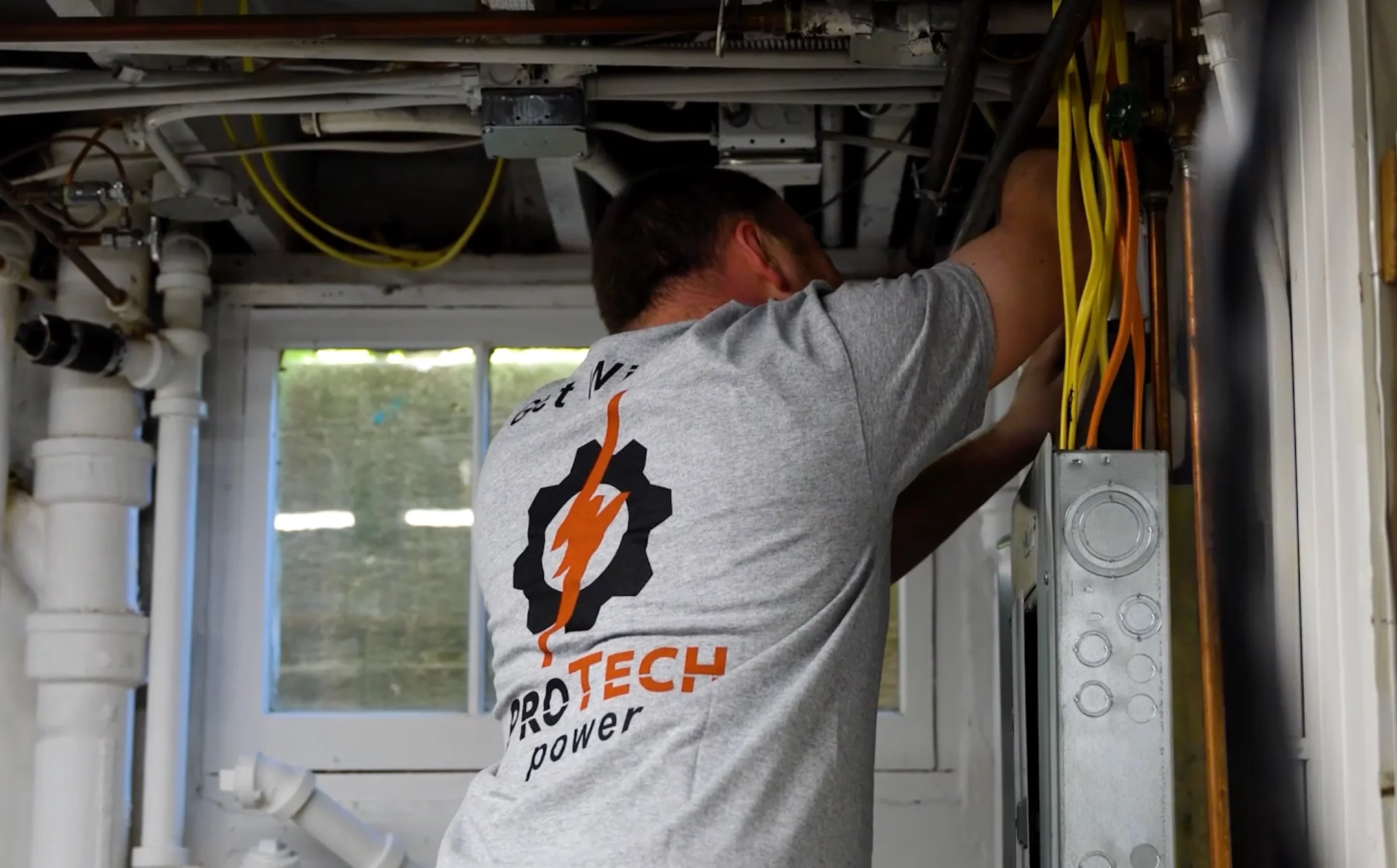 Pro Tech Power electrician performing panel work