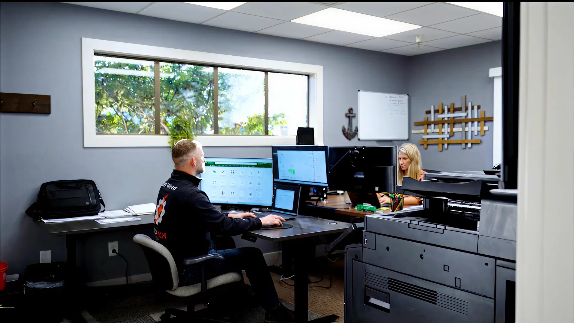 Pro Tech Power team coordinating projects in the company office