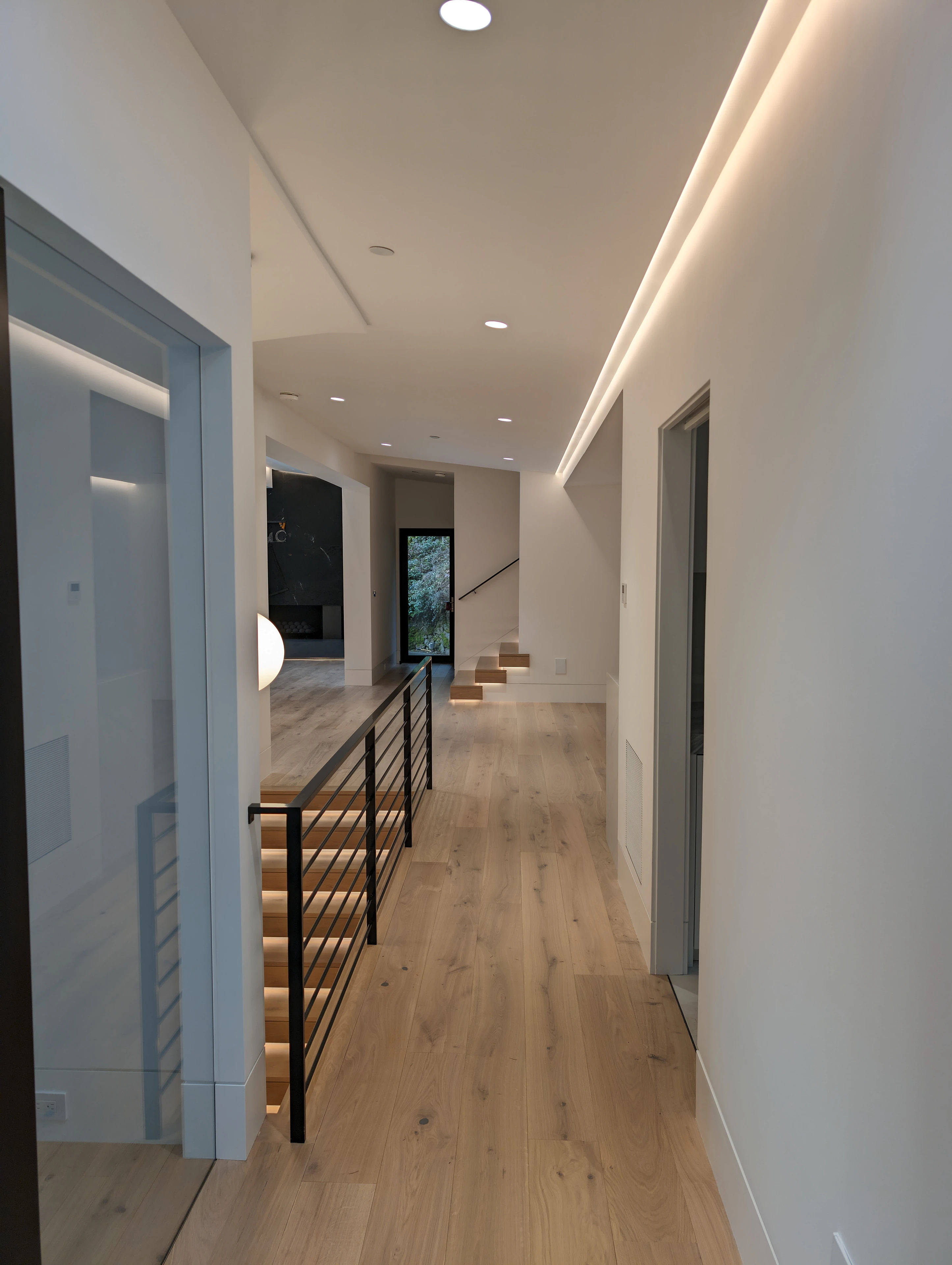 Completed residential hallway recessed lighting installation