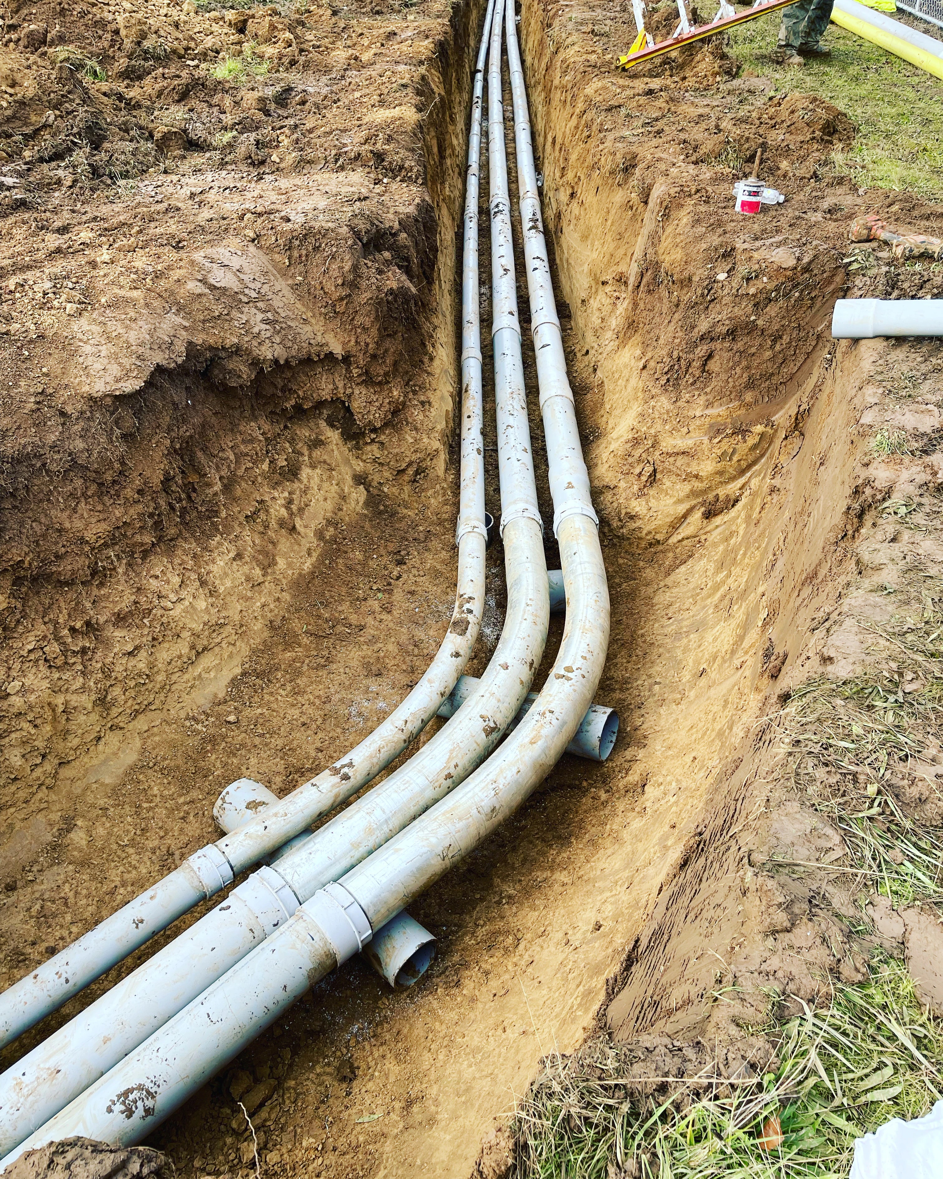 Underground electrical conduit installation prepared for a new construction project